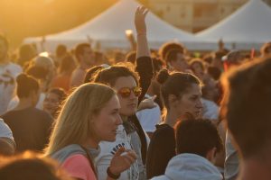 crowd of people who are stood close to one another