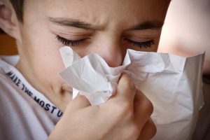 child sneezing with a cold