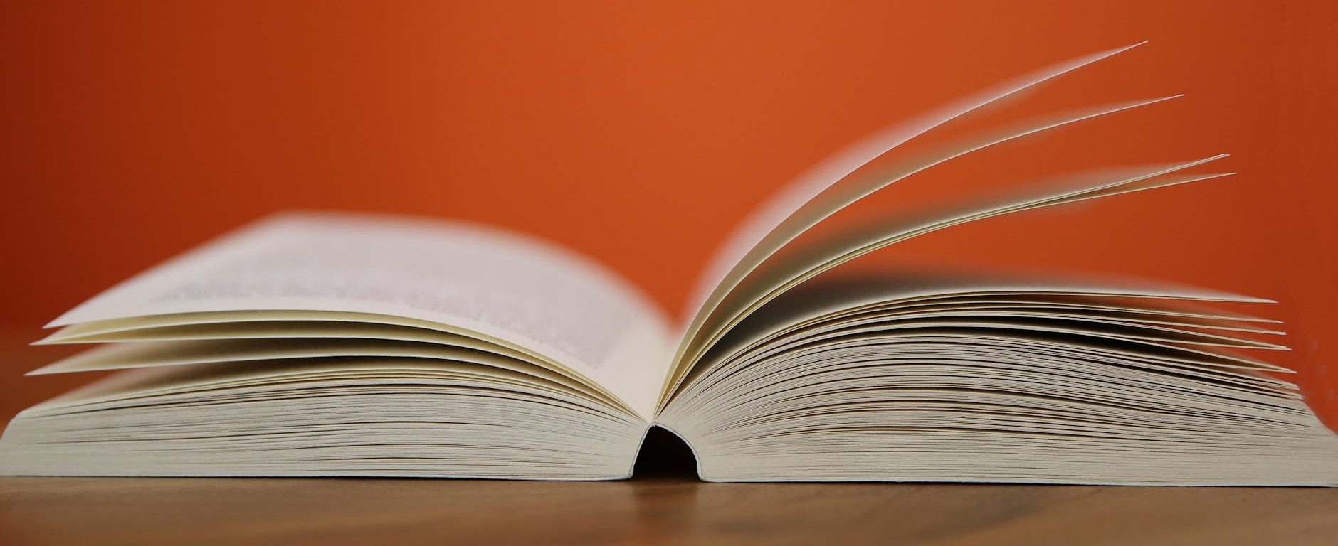 selective focus photography of white softbound book