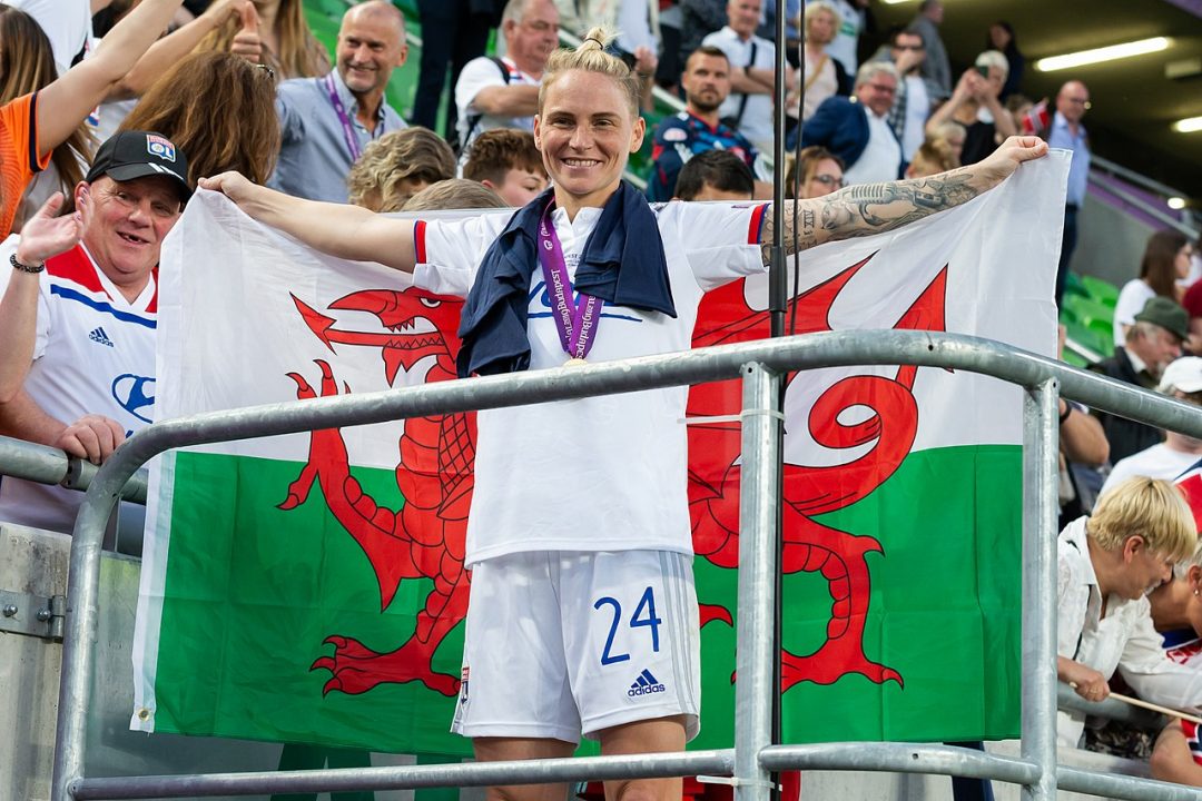 Jess Fishlock draped in the Welsh flag