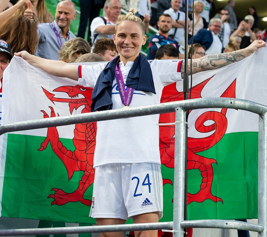 Jess Fishlock draped in the Welsh flag