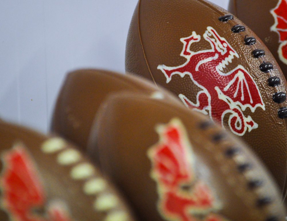 Chocolate rugby ballls with a Welsh dragon on them