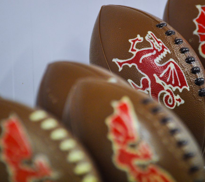 Chocolate rugby ballls with a Welsh dragon on them