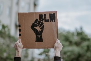 Poster with a raised fist next to the letters "BLM"