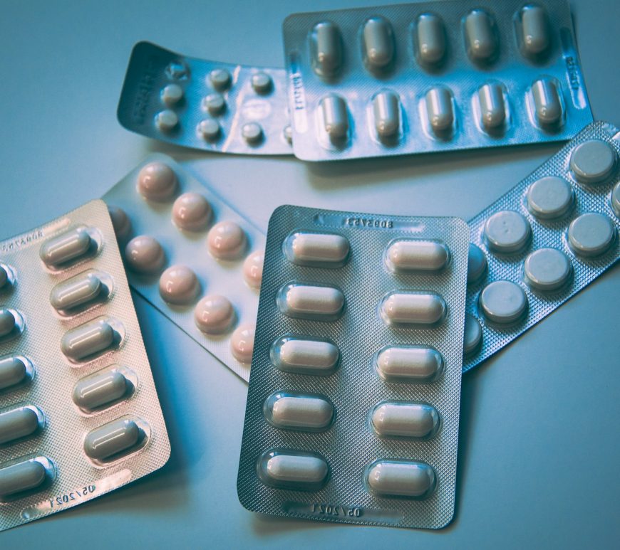 Photo of different medicine packets with a grey tinge.