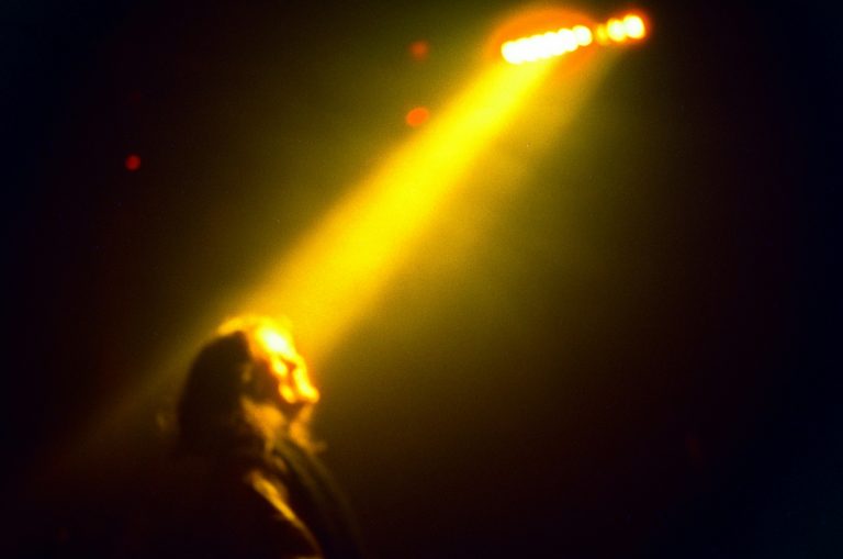 Woman standing in spotlight