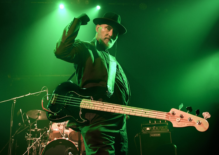 Jah Wobble on stage with The Invaders of the Heart on tour