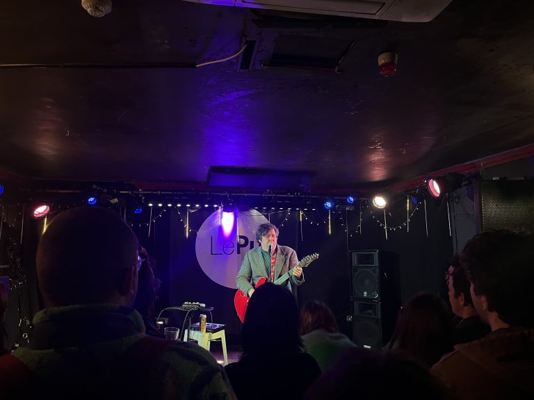 Image of Jim E. Brown on stage at Le Pub