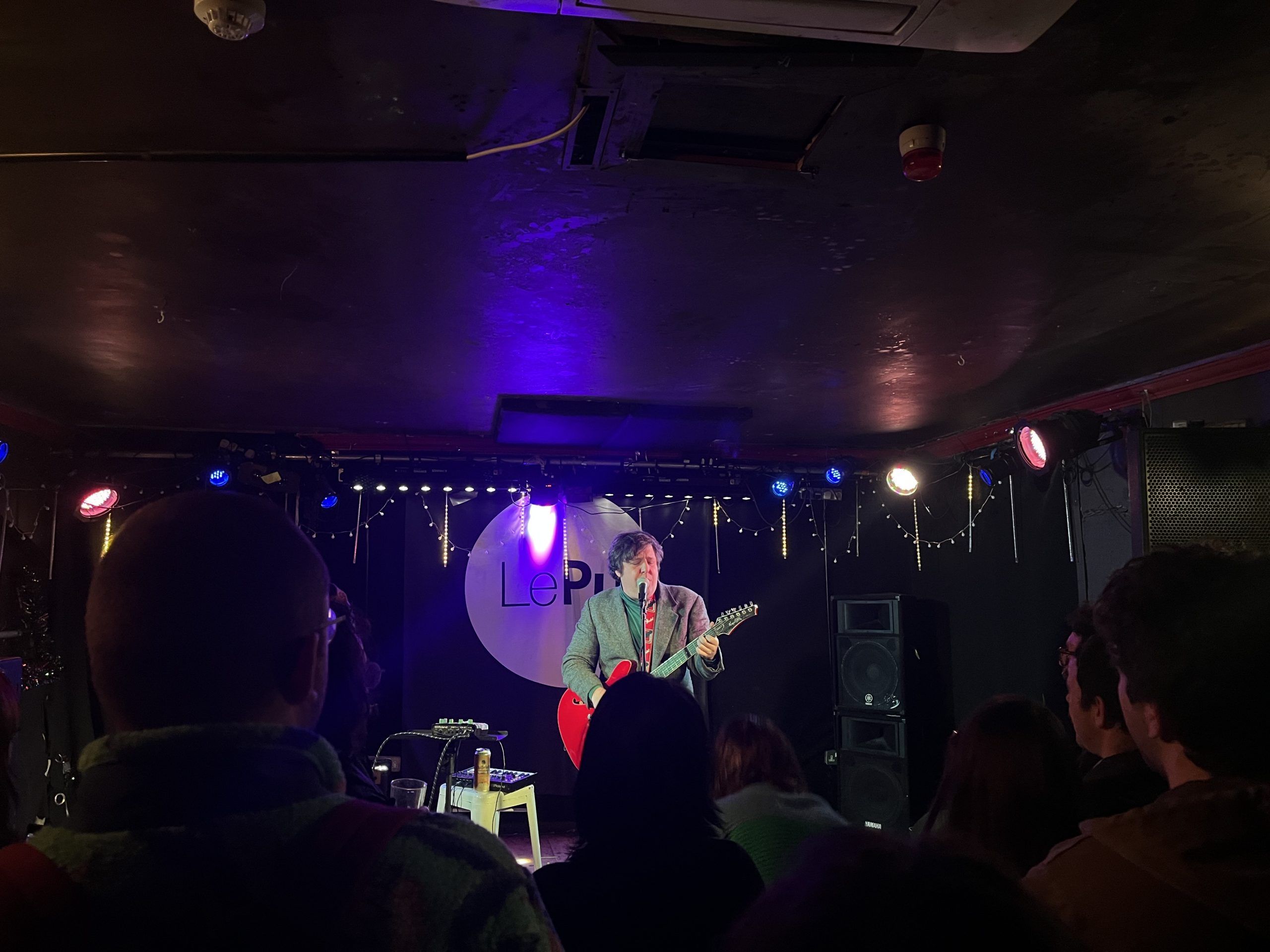 Image of Jim E. Brown on stage at Le Pub