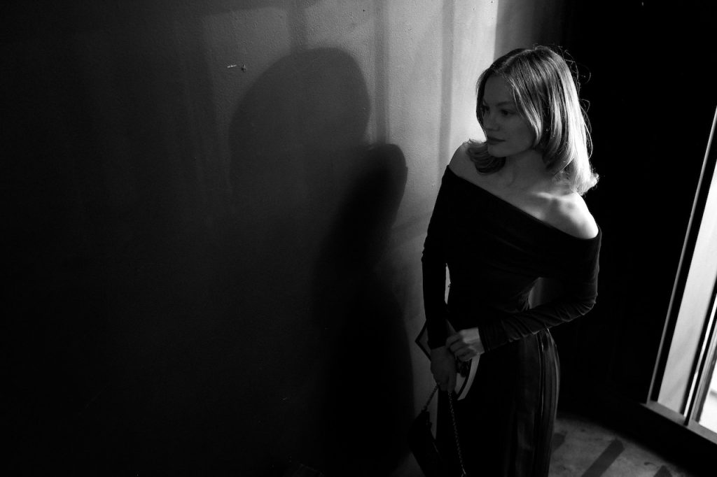 black and white image of a woman in a dress